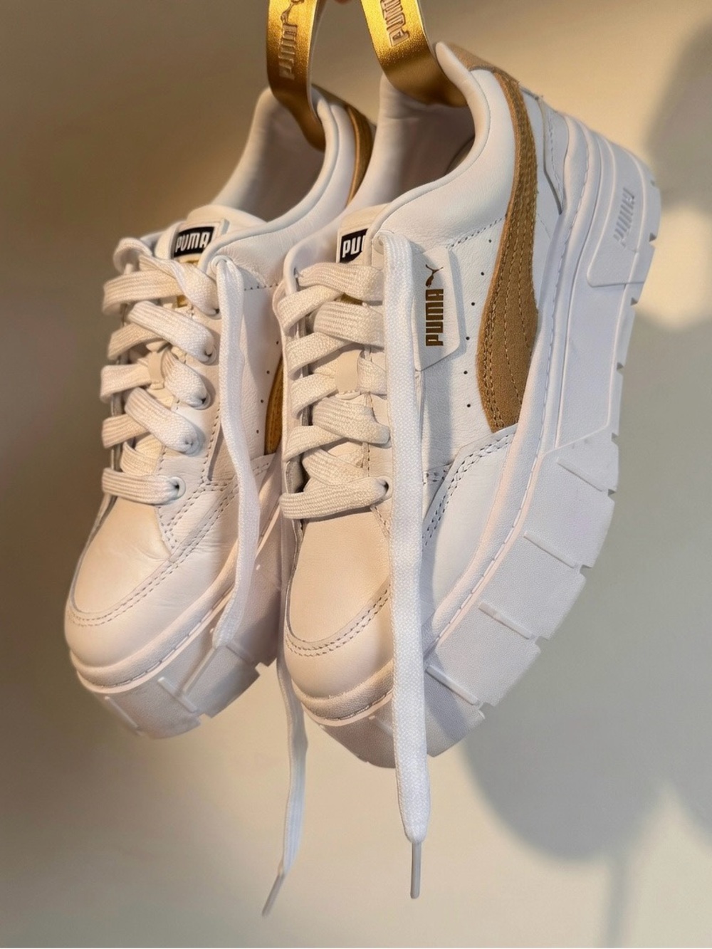 Puma White Sneakers with Tan Heel Accent